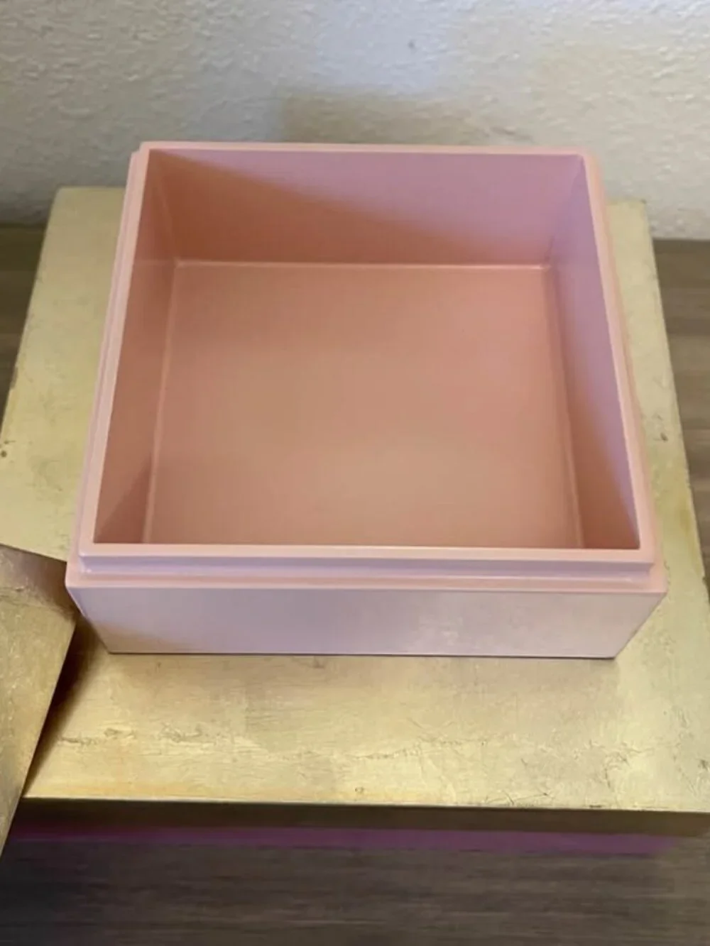 Set of two pink and gold laquered decorative square storage boxes